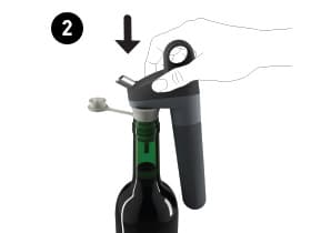 Pivot System being inserted into a wine bottle with Pivot Stopper.