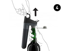 Pivot System being pulled off of a bottle and Pivot Stopper.