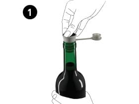 Pivot stopper being inserted into a wine bottle.
